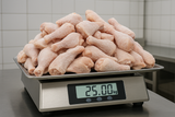 25kg of frozen chicken on scale weign scale showing 25kg